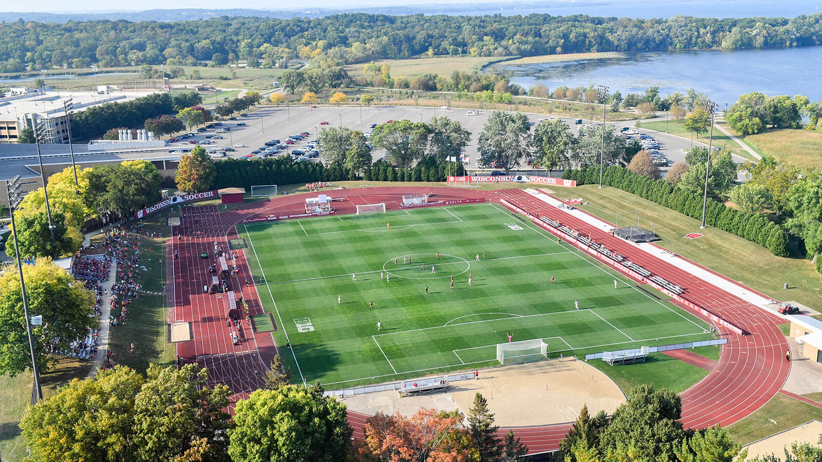 Aerial view of an outdoor soccer field surrounded by a large 